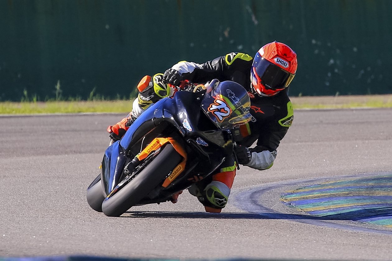 Rafael Yashiki Capua riding motorcycle number 72 through a corner at a racetrack